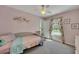 Bedroom featuring a daybed by a window with patterned curtains, and plush carpeting at 5108 Staplehurst Ln, Woodstock, GA 30189
