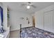 Bedroom featuring built-in shelves, a cozy window seat, and a ceiling fan at 5108 Staplehurst Ln, Woodstock, GA 30189