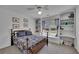 Bright bedroom featuring built-in shelves, a cozy window seat, and a ceiling fan at 5108 Staplehurst Ln, Woodstock, GA 30189