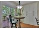 Cozy breakfast nook with outdoor views, a small table, and plenty of storage at 5108 Staplehurst Ln, Woodstock, GA 30189