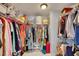 Walk-in closet with metal shelving and an abundance of hanging and storage space at 5108 Staplehurst Ln, Woodstock, GA 30189