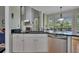 Kitchen area with granite counters, stainless steel appliances, and natural light at 5108 Staplehurst Ln, Woodstock, GA 30189