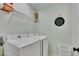 Well-equipped laundry room with a modern washer and dryer, plus shelving at 5108 Staplehurst Ln, Woodstock, GA 30189