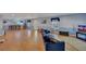 Open-concept living room with wood floors, a wet bar, and plenty of room for seating at 5108 Staplehurst Ln, Woodstock, GA 30189