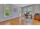 Bright office space with hardwood floors, natural light, and a view of the outdoors at 5108 Staplehurst Ln, Woodstock, GA 30189