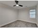 Bright bedroom features soft gray carpet and a modern ceiling fan at 538 Center Hill Nw Ave, Atlanta, GA 30318
