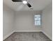 This cozy bedroom has soft gray carpet and a bright window at 538 Center Hill Nw Ave, Atlanta, GA 30318
