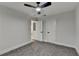 Carpeted bedroom features neutral walls, white trim, and ceiling fan at 538 Center Hill Nw Ave, Atlanta, GA 30318