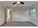 This bedroom features carpet flooring, fresh paint, and a window at 538 Center Hill Nw Ave, Atlanta, GA 30318