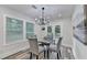 Bright dining room featuring a glass top table, modern chandelier and view to the deck at 538 Center Hill Nw Ave, Atlanta, GA 30318