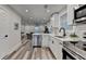 Modern kitchen with stainless steel appliances, white cabinets, and stylish black hardware at 538 Center Hill Nw Ave, Atlanta, GA 30318