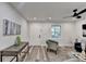 Living area with modern flooring, and a stylish gray chair at 538 Center Hill Nw Ave, Atlanta, GA 30318