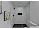 This shower has marble-look tiling, black hardware, and a built in soapbox at 538 Center Hill Nw Ave, Atlanta, GA 30318
