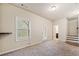 Finished basement area with carpet, a walkout door, and a nearby bathroom at 6404 Brookside Se Blvd, Mableton, GA 30126