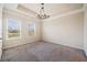 Unfurnished carpeted bedroom featuring two windows, perfect for customization and comfort at 6404 Brookside Se Blvd, Mableton, GA 30126