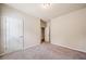 Carpeted bedroom featuring a closet and interior door, offering comfort and convenience at 6404 Brookside Se Blvd, Mableton, GA 30126