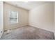 Neutral bedroom has a window and neutral carpet at 6404 Brookside Se Blvd, Mableton, GA 30126