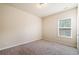 Neutral bedroom with carpet flooring and a window providing natural light at 6404 Brookside Se Blvd, Mableton, GA 30126
