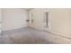 Bedroom with neutral carpet and access to the outside at 6404 Brookside Se Blvd, Mableton, GA 30126