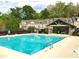 Community pool featuring lounge seating with a nearby gazebo for residents and guests at 6404 Brookside Se Blvd, Mableton, GA 30126
