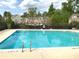 A clean community pool features metal ladders and ample space for residents to enjoy at 6404 Brookside Se Blvd, Mableton, GA 30126