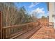 Wooden deck offers scenic views of the surrounding mature trees and landscaping at 6404 Brookside Se Blvd, Mableton, GA 30126