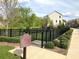 Community dog park featuring a fenced area and detailed rules and regulations posted at 6404 Brookside Se Blvd, Mableton, GA 30126