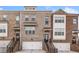 Charming brick townhouse with a one-car garage and welcoming front entrance with stairs at 6404 Brookside Se Blvd, Mableton, GA 30126