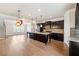 Stylish kitchen featuring a large center island, stainless steel appliances, and dark cabinetry at 6404 Brookside Se Blvd, Mableton, GA 30126