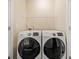 Laundry room showcasing side-by-side washer and dryer units, ready for your laundry needs at 6404 Brookside Se Blvd, Mableton, GA 30126