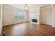 Bright living room with hardwood floors, fireplace, and large windows for natural light at 6404 Brookside Se Blvd, Mableton, GA 30126