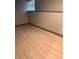 Finished basement with luxury vinyl plank flooring and neutral wall color at 7027 Grinder Drive, Austell, GA 30168