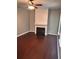 Living room featuring a decorative fireplace, ceiling fan and neutral colors, great for relaxing and entertaining at 7027 Grinder Drive, Austell, GA 30168