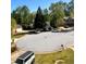 Residential street featuring multiple homes and well-maintained yards at 7027 Grinder Drive, Austell, GA 30168