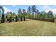 A spacious backyard includes a lush lawn and fencing, perfect for outdoor enjoyment at 2111 Harmony Dr, Canton, GA 30115