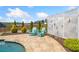 Inviting pool area with lounge chairs, a stylish privacy screen, and lush landscaping at 2111 Harmony Dr, Canton, GA 30115
