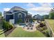 A luxurious backyard with a sparkling pool, inviting lounge chairs, and lush landscaping creating an oasis at 2111 Harmony Dr, Canton, GA 30115