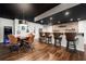Entertainment basement featuring a bar area, guitar wall decor, tile backsplash, and table with chairs at 2111 Harmony Dr, Canton, GA 30115