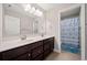 This bathroom has and sinks and a privacy door for the commode and shower at 2111 Harmony Dr, Canton, GA 30115
