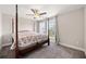 Cozy bedroom with a four-poster bed and natural light at 2111 Harmony Dr, Canton, GA 30115