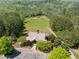 Aerial view of the community clubhouse surrounded by trees and parking at 2111 Harmony Dr, Canton, GA 30115