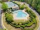 Aerial view of a community pool area with slides, swimming pool, and landscaping at 2111 Harmony Dr, Canton, GA 30115