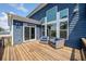 Inviting deck with sliding door access and comfortable seating area with stylish furniture at 2111 Harmony Dr, Canton, GA 30115