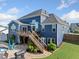 An attractive exterior showcasing a spacious wooden deck perfect for relaxation and easy access to the backyard pool at 2111 Harmony Dr, Canton, GA 30115
