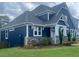 Beautiful two-story home featuring blue siding with white trim and well-maintained landscaping under an overcast sky at 2111 Harmony Dr, Canton, GA 30115