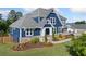 A charming home with a beautifully landscaped front yard, offering curb appeal and a welcoming entrance at 2111 Harmony Dr, Canton, GA 30115