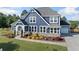 A gorgeous home featuring a well-maintained lawn and beautiful landscaping enhancing curb appeal at 2111 Harmony Dr, Canton, GA 30115