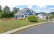 An eye-level street view displays a well-manicured lawn and beautiful blue house at 2111 Harmony Dr, Canton, GA 30115