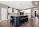 Modern kitchen with a large center island, granite countertops, stainless steel appliances, and pendant lighting at 2111 Harmony Dr, Canton, GA 30115