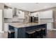 Gourmet kitchen features a large center island with seating and modern pendant lights at 2111 Harmony Dr, Canton, GA 30115